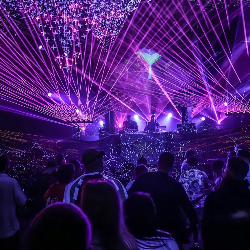 Purple laser show above the crowd